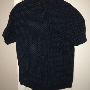 Blue button-up shirt with blue and gold designs.